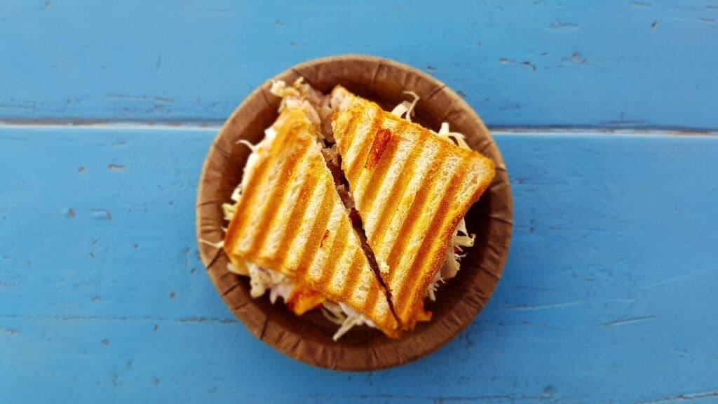 Delicious French toast sandwich with cheese, tomato, and ham, perfect for a quick homeschool lunch