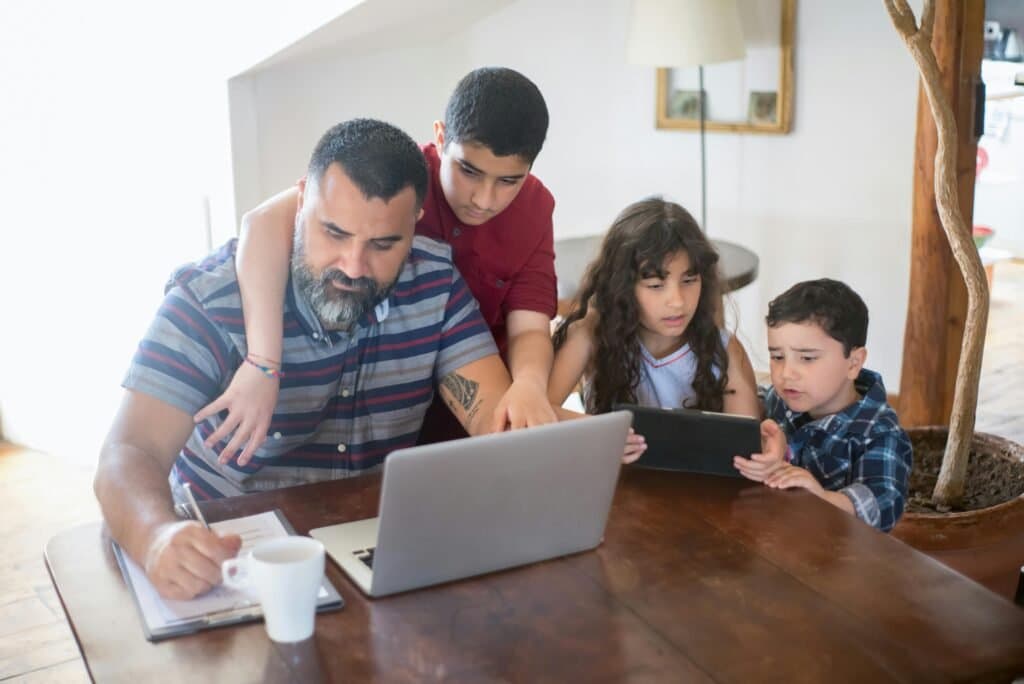 Parent and child reviewing information for choosing a boarding school